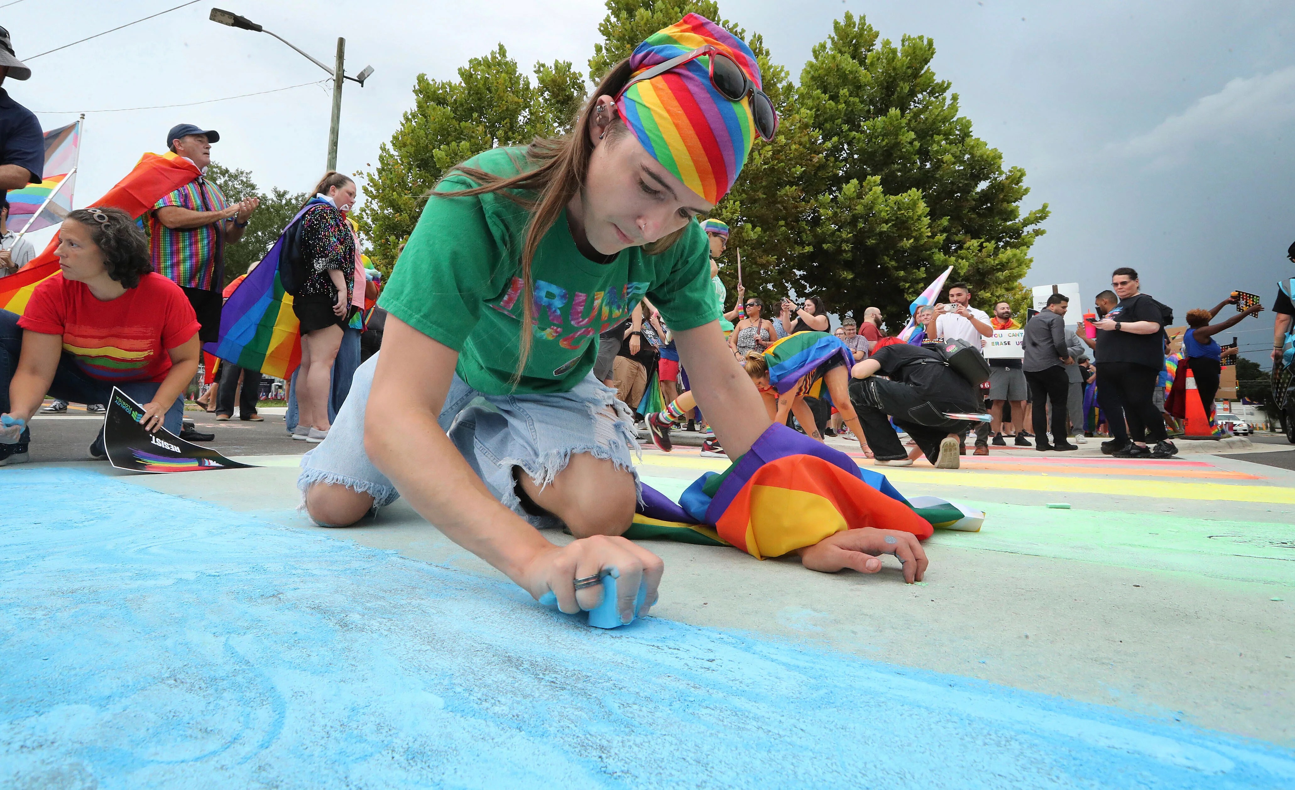 Advocates use chalk to color in rainbow crosswalk near Pulse nightclub that was removed on Trump’s order Advocates use chalk to color in rainbow crosswalk near Pulse nightclub that was removed on Trump’s order
