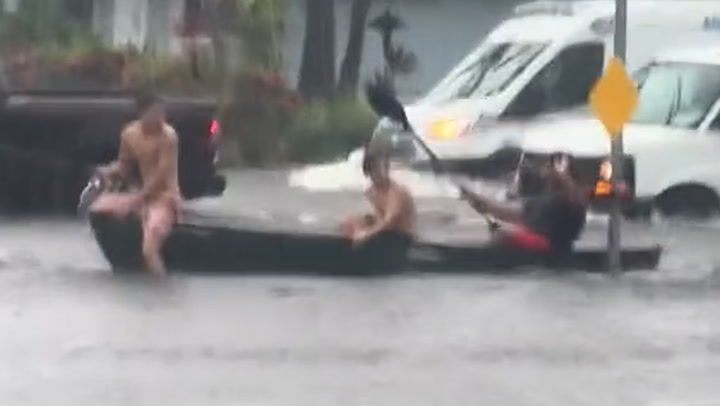 Trio brave Florida floodwaters by riding across intersection in canoe | News