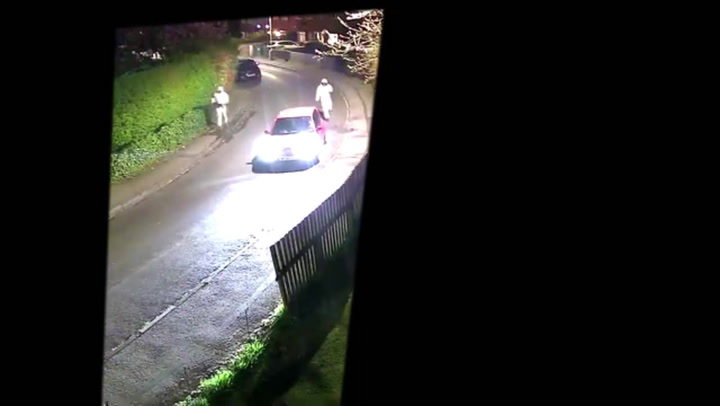 Armed men disguised in hazmat suits chase wrong victim down the street | News