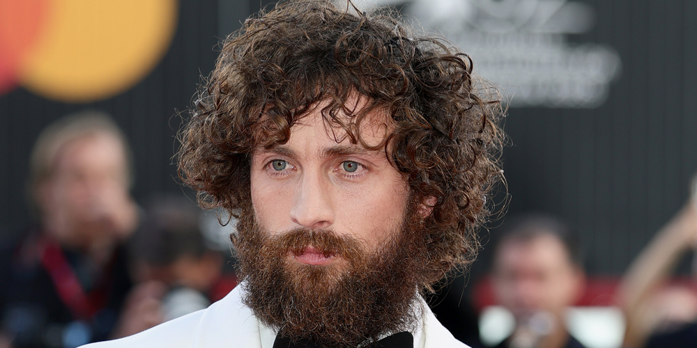 Aaron Taylor-Johnson Shows Off Shaggy Look at Venice &apos;Frankenstein&apos; Premiere