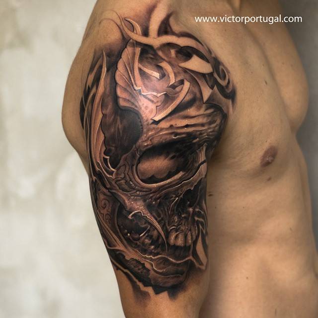 Black And Grey Skull Tattoo On The Right Upper Arm And 640_x_640_jpg