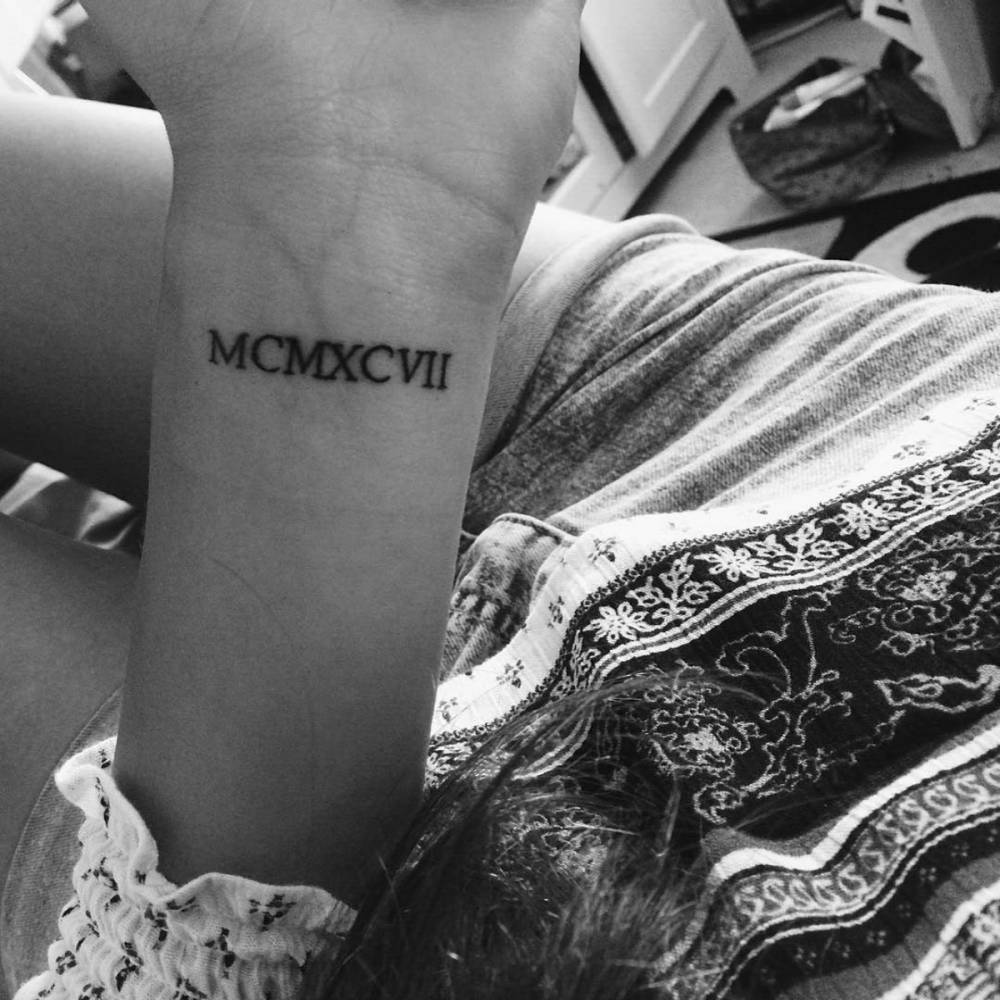 1997 In Roman Numerals On Gina's Wrist. 1000_x_1000_jpg