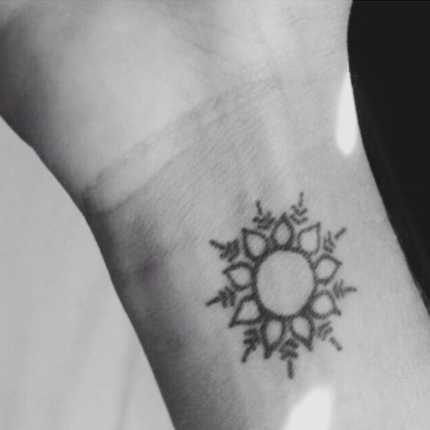 Wrist Tattoo Of The Sun On Amelia. 849_x_849_jpg