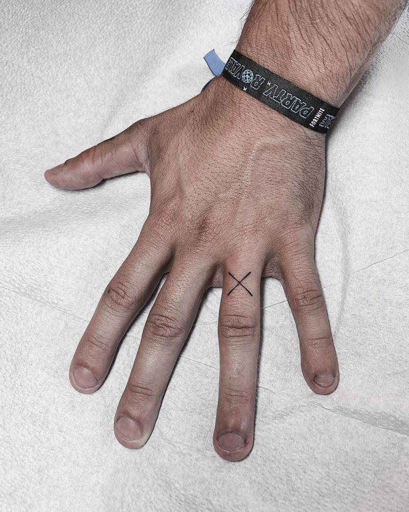 X Letter Tattoo On The Left Ring Finger. 1000_x_800_jpg