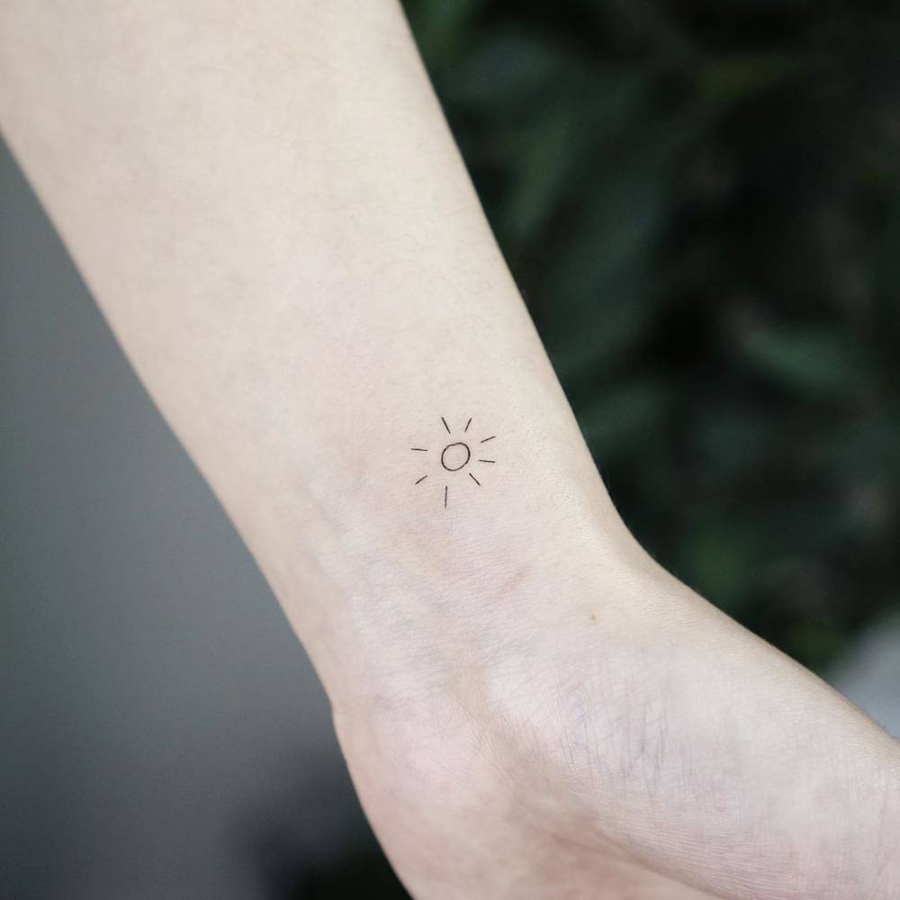 Minimalist Sun Tattoo On The Wrist. 1000_x_1000_jpg