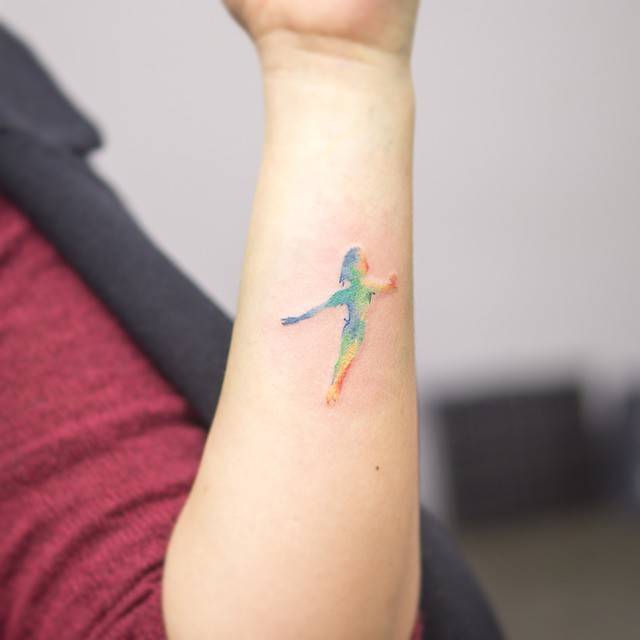 Watercolor Peter Pan Shaped Tattoo On The Forearm. 640_x_640_jpg