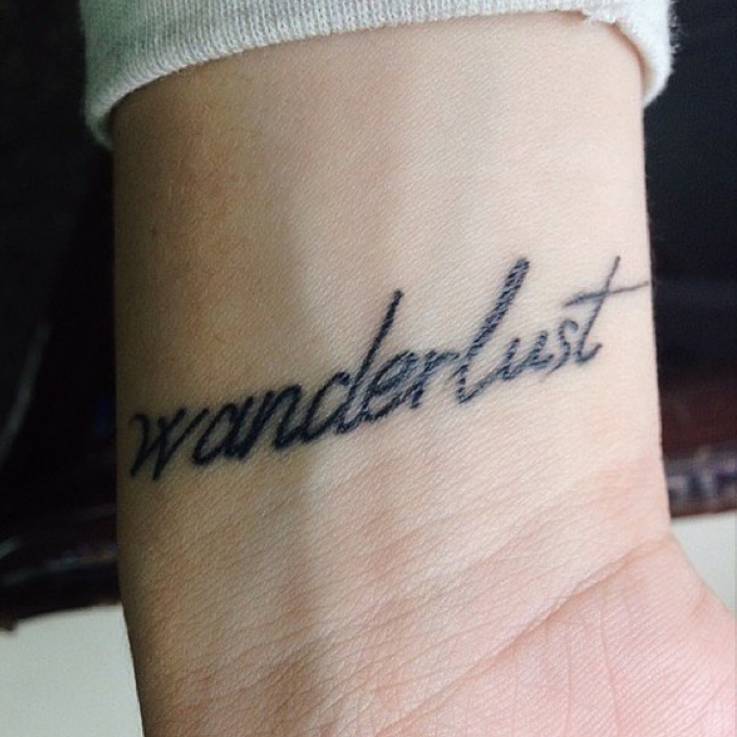 Wanderlust" Tattoo On Abril's Wrist.