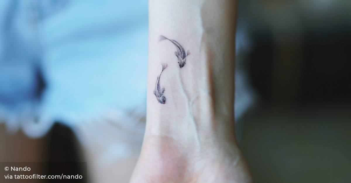 Fish Couple Tattoo On The Wrist. 628_x_1200_jpg