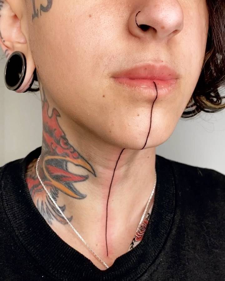 Line Tattoo On Neck And Face 900_x_720_jpg