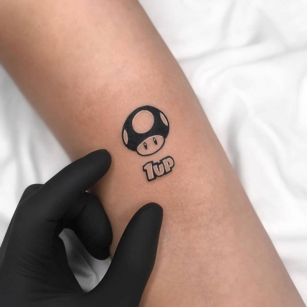 Mario Bros' 1 Up Mushroom Tattoo On The Bicep. 1000_x_1000_jpg
