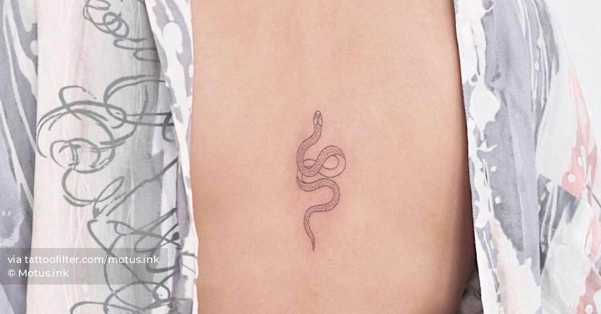 Fine Line Snake Tattoo On The Back. 628_x_1200_jpg