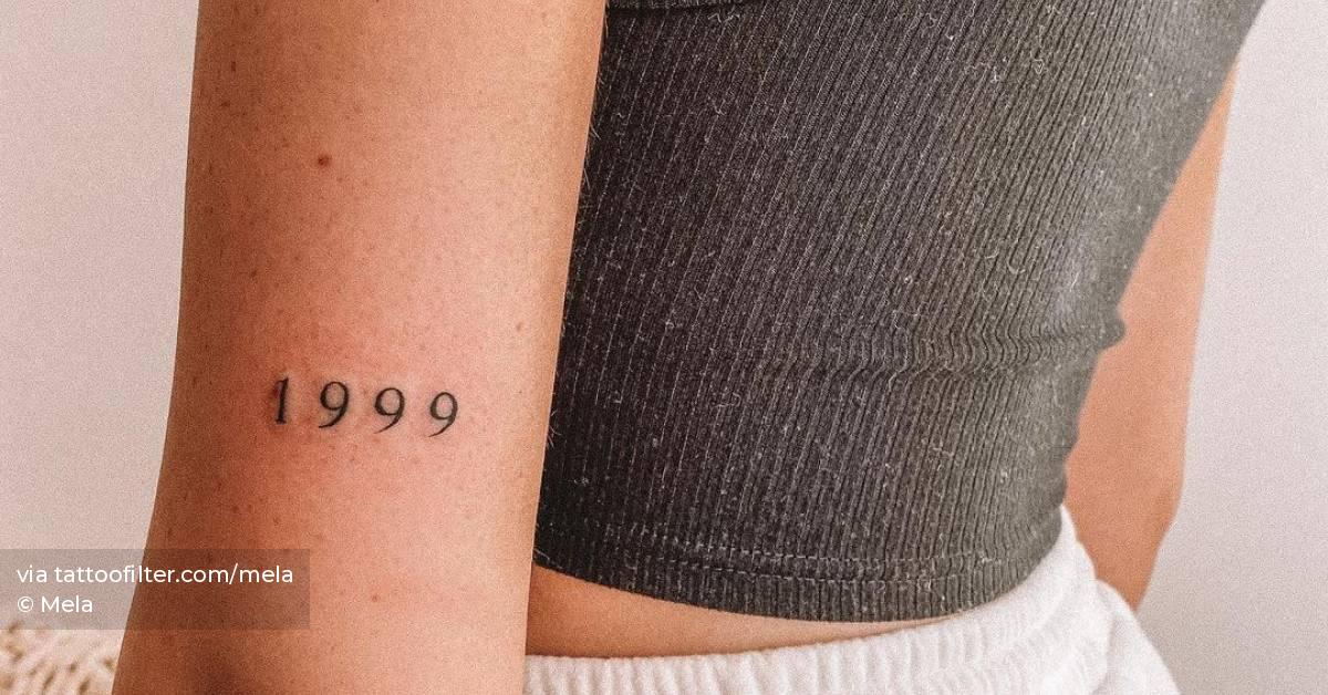 1999" Lettering Tattoo On The Tricep. 628_x_1200_jpg
