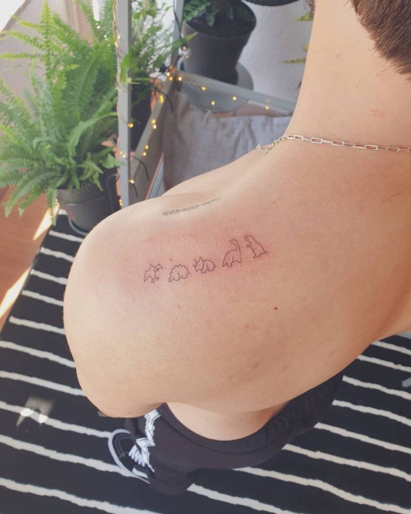 Minimalist Dinosaurs Tattoo On The Top Of The Shoulder. 1000_x_800_jpg