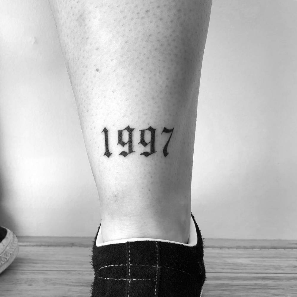 1997' Lettering Tattoo On The Achilles. 1000_x_1000_jpg