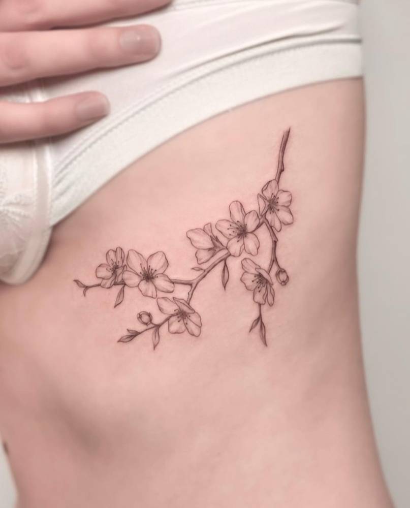 Fine Line Cherry Blossom Tattoo On The Rib. 1000_x_807_jpg