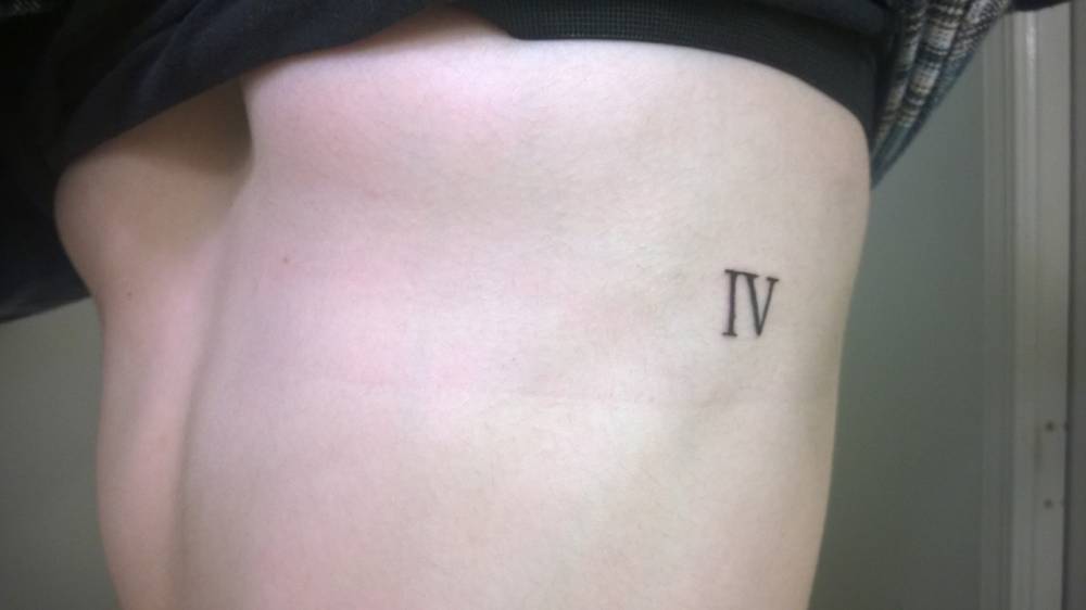 Side Tattoo Of The Number Four In Roman Numerals. 562_x_1000_jpg