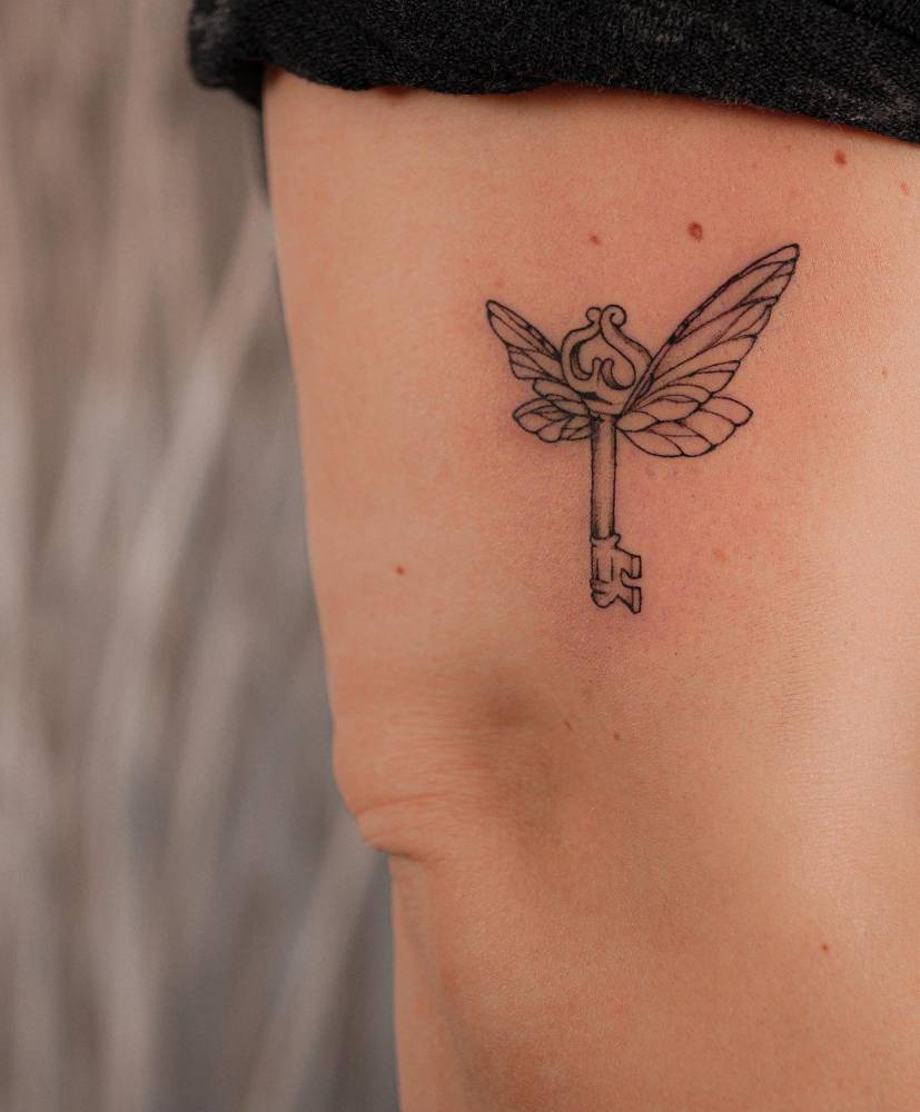 Winged Key Tattoo Located On The Upper Arm. 1000_x_827_jpg