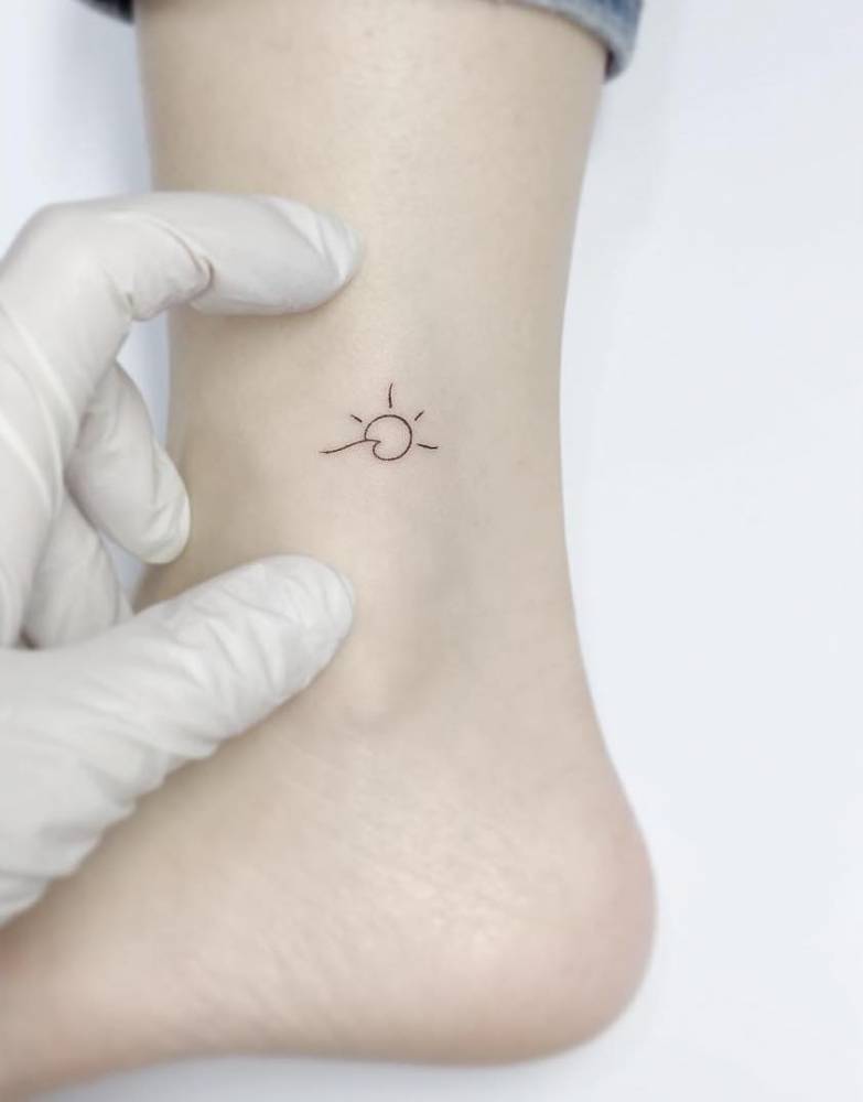 Minimalist Sun And Wave Tattoo On The Ankle. 1000_x_783_jpg
