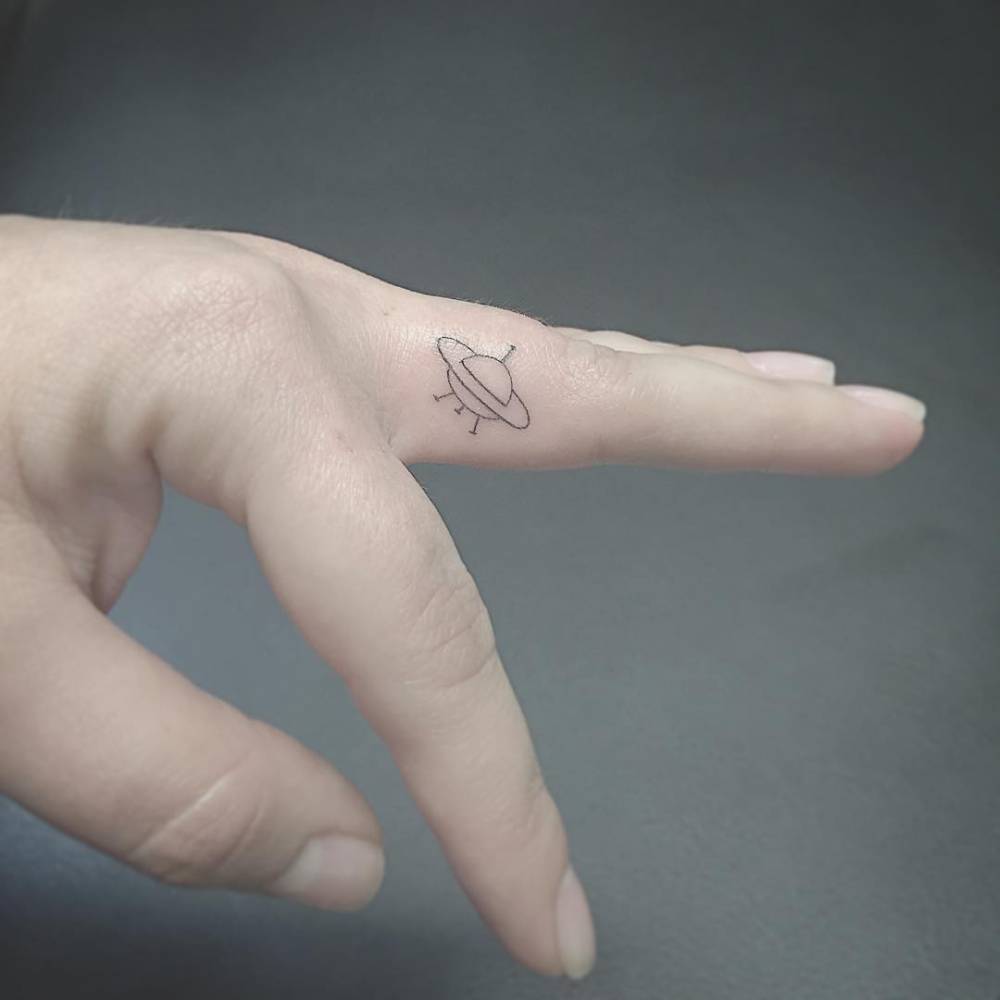 Small Ufo Tattoo On The Left Middle Finger. 1000_x_1000_jpg