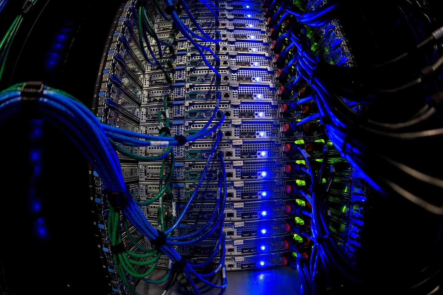 Network cables and illuminated equipment in Wikimedia Foundation server racks