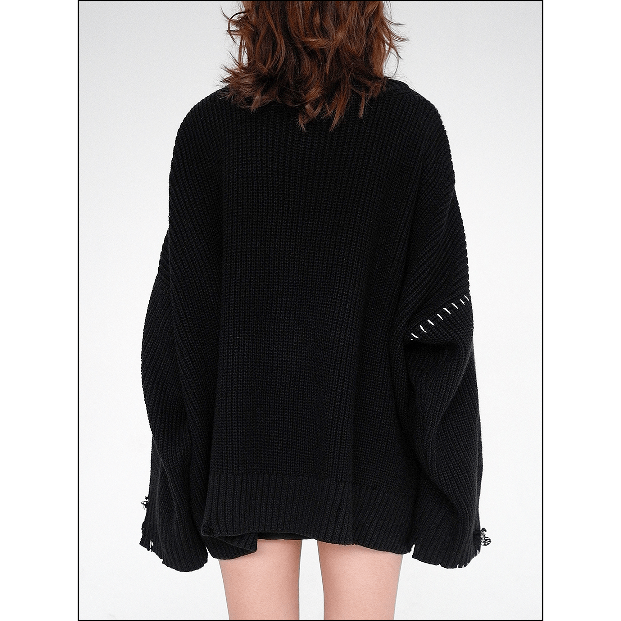 Distressed black sweater