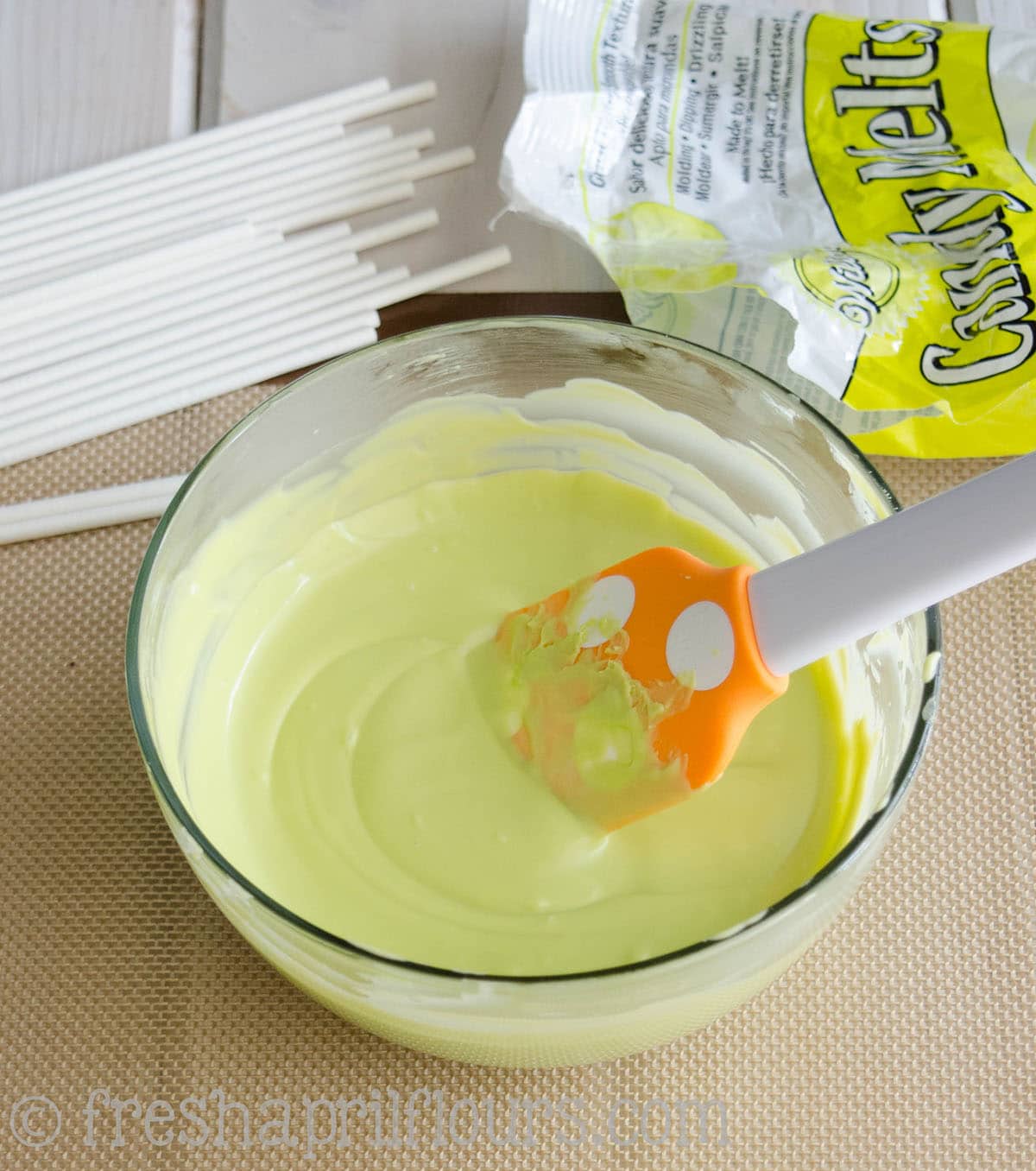 melted bright green candy melts to make cake pops