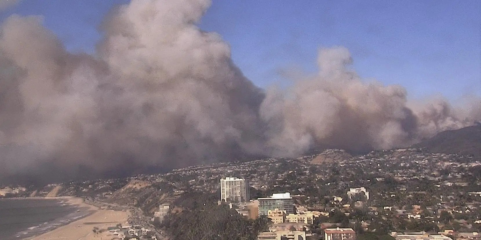 700-plus-acre brush fire erupts in affluent Pacific Palisades neighborhood of Los Angeles, prompting mandatory evacuations