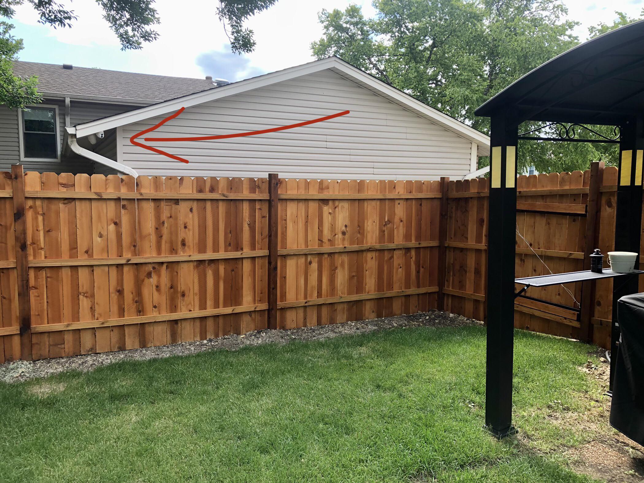 How to hang a gate on a wooden post