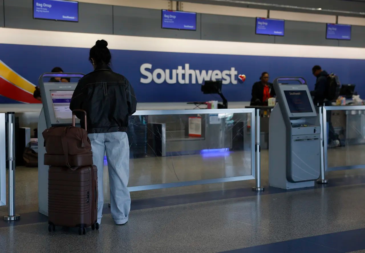 Southwest says assigned seats will make it more profitable this year, as stock rallies