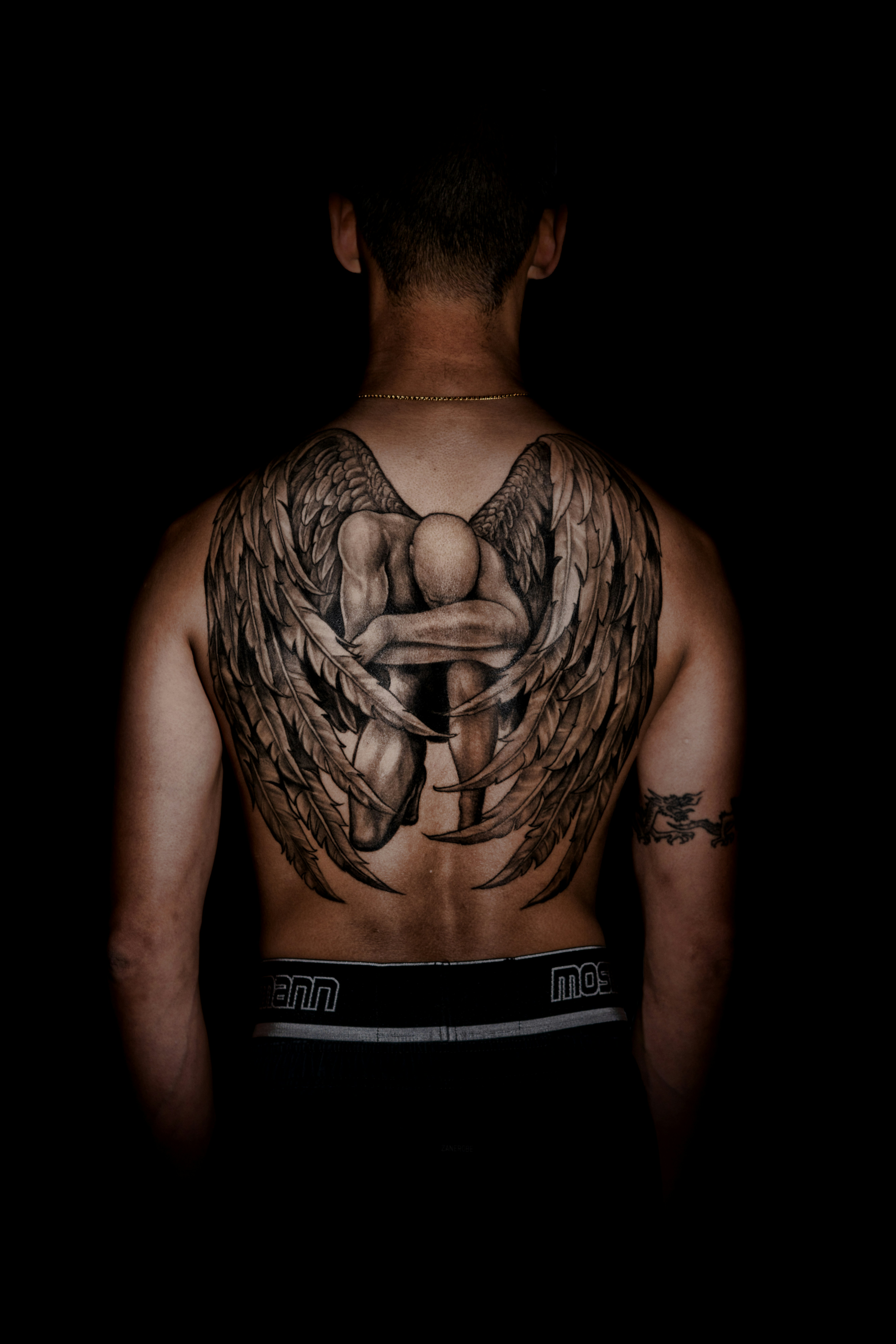 Person With Kneeling Angel Back Tattoo Photo – Free Tattoo Image On Unsplash 1499_x_1000_jpg