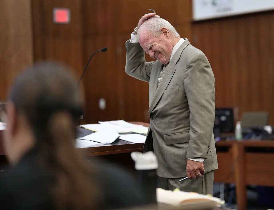 Defense attorney Kevin Reddington expressing frustration during a cross-examination in court.