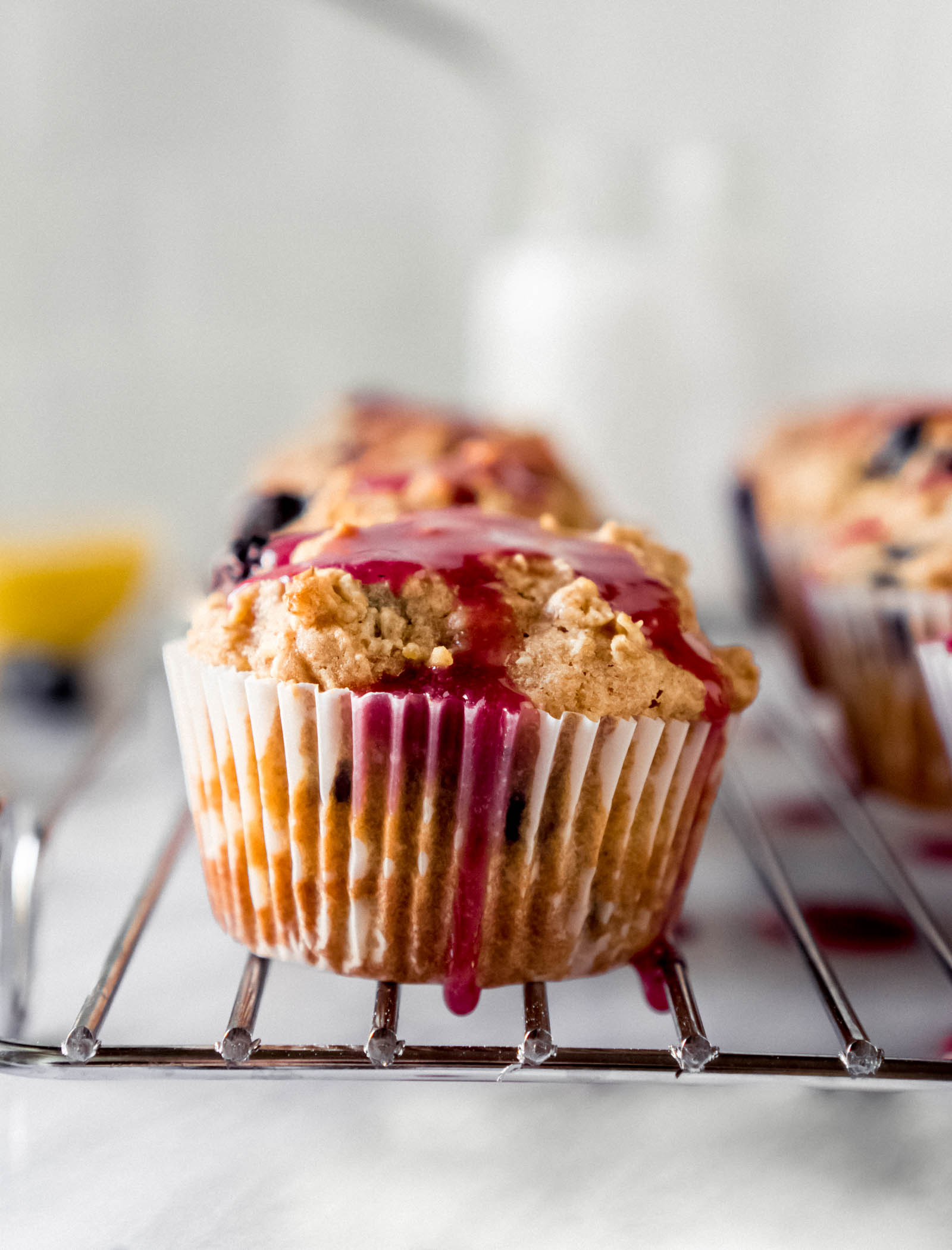 lemon blueberry muffins on a cooling rack