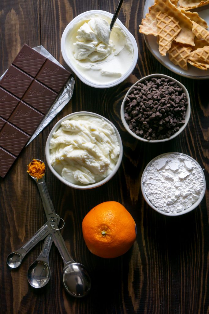 chocolate chips, ricotta cheese, an orange, and a chocolate bar