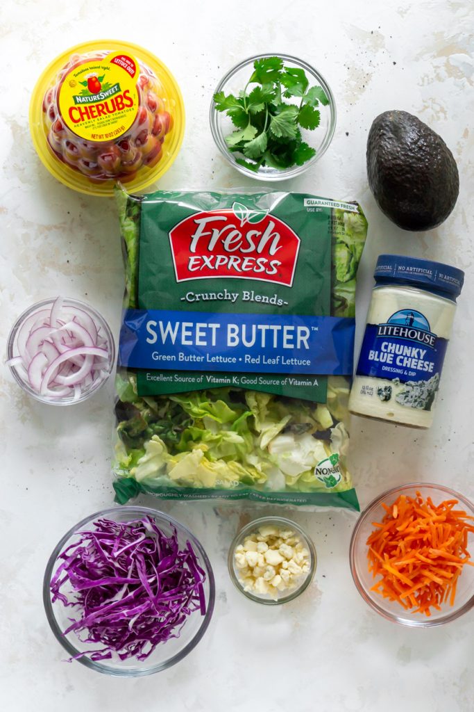 lettuce in a bag, dressing, tomatoes, shredded carrots, shredded purple cabbage, avocado, cilantro, sliced red onions