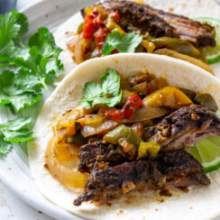 close up of steak fajitas on a plate