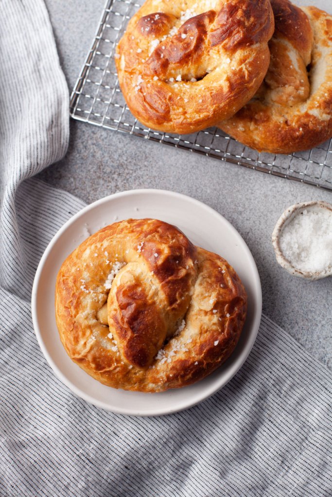 homemade soft pretzel on a white plate