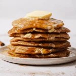 a stack of spiced apple pancakes on a plate