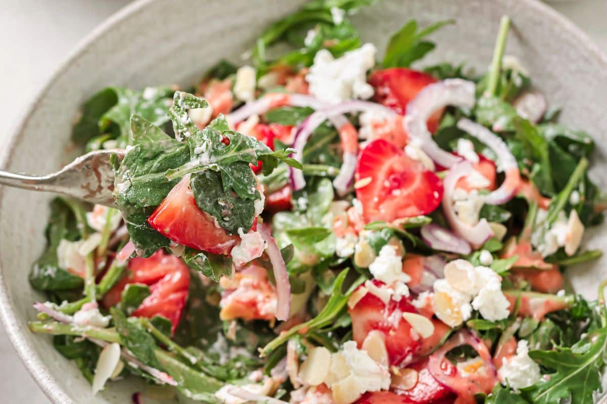 The finished salad tossed with strawberry dressing.