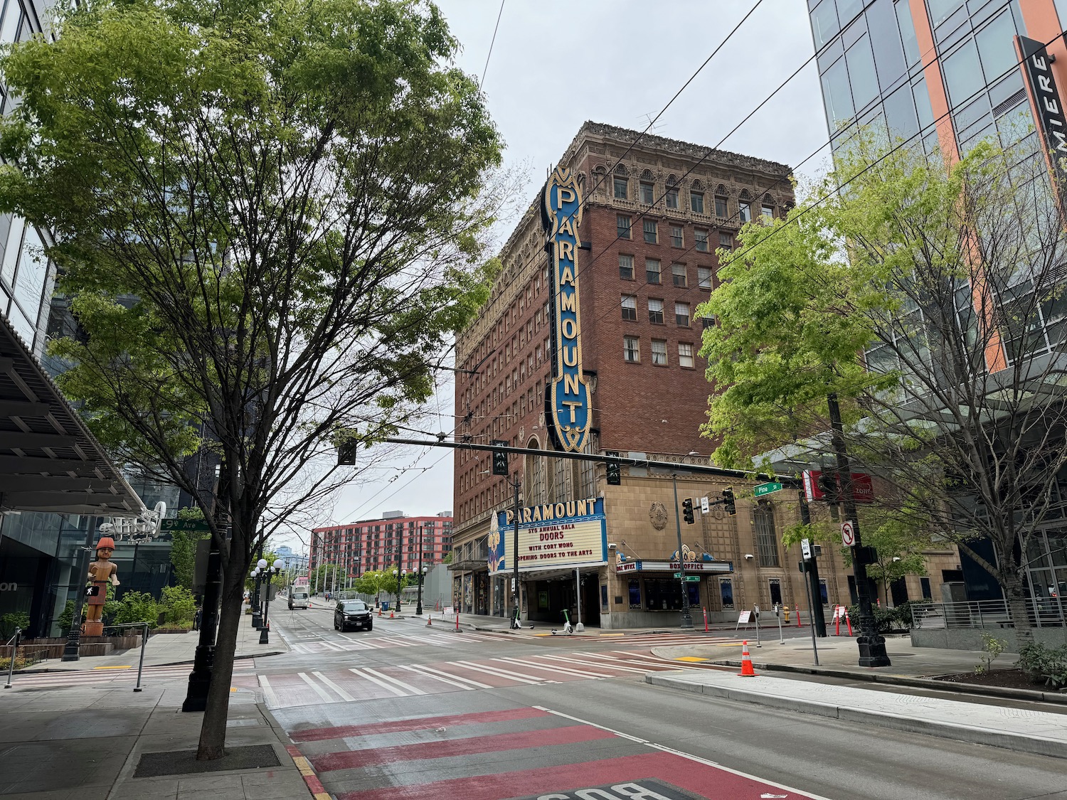 a street with a building and trees