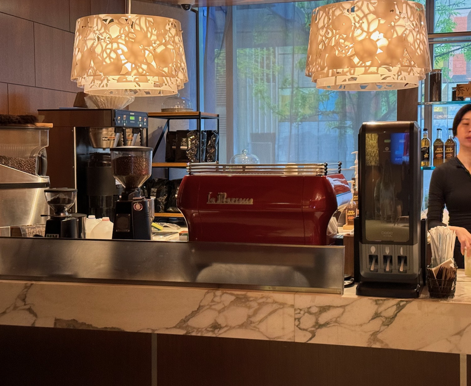 a coffee machine and coffee maker on a counter