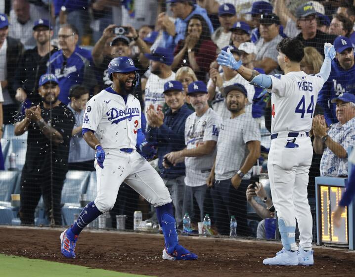 Dodgers waste no time finding their October groove in Game 1 win over Reds