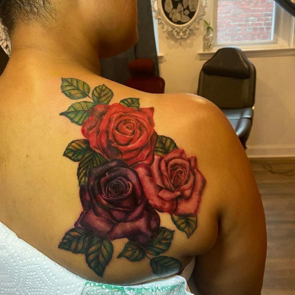  Red Ink Tattoo On Dark Skin Female 