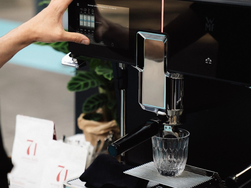 - Healthy Brew Hub German Barista Champion Daniel Gerlach prepares a drink on an automated coffee machine.