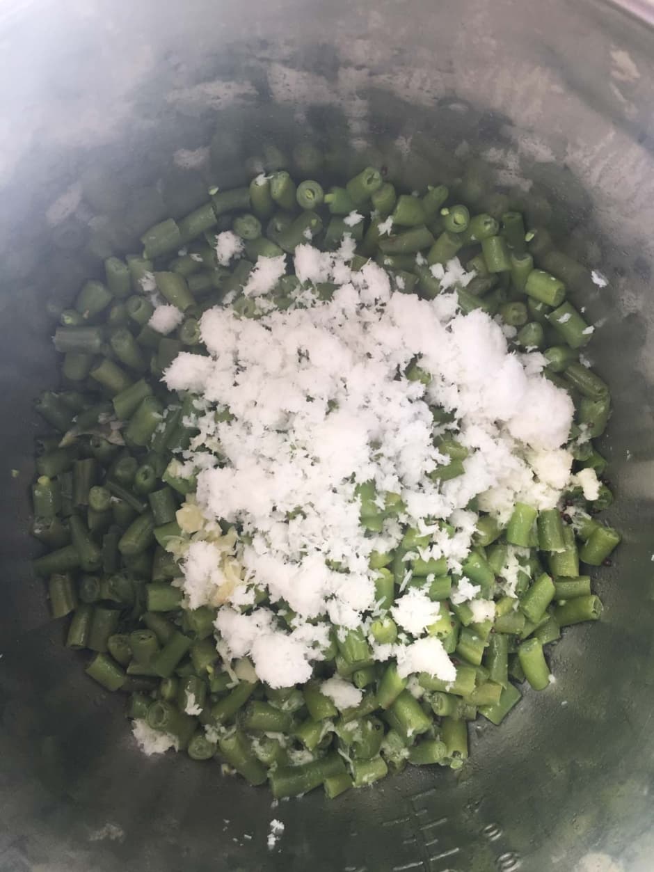 grated coconut sprinkled over cooked beans