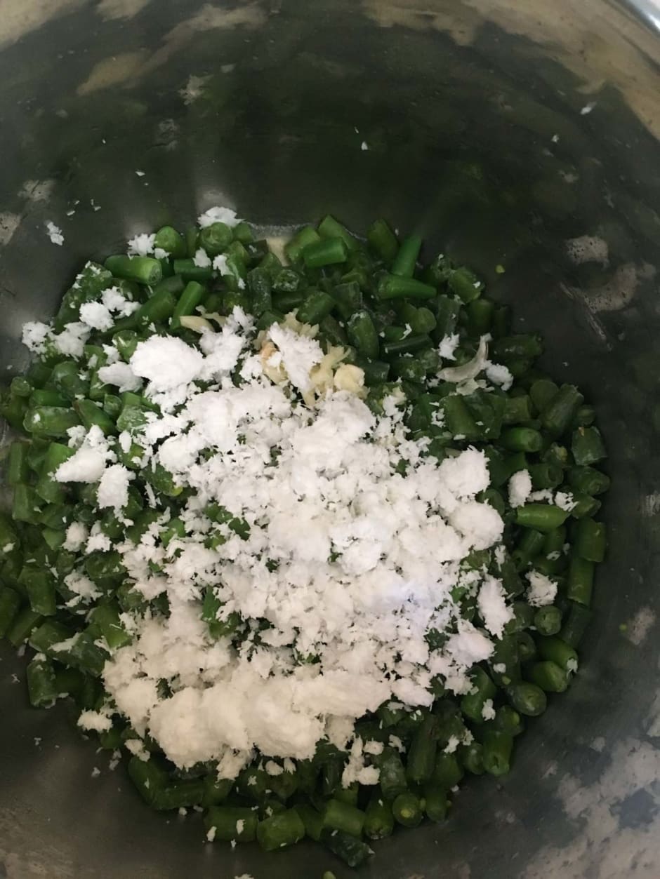 Grated coconut over beans