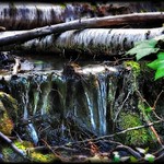 Tiny falls near a big mountain