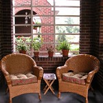 Wicker chairs on our front porch