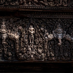 Details of Characters on Artwork above a Doorway at Banteay Srei Temple, Angkor, Cambodia-60a
