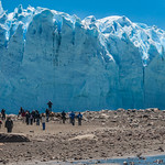 Hikers dwarfed by massive terminus of Perito Moreno glacier - Patagonia Argentina