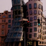 Building standing with red and green traffic lights